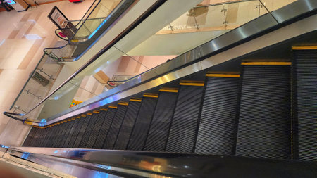 Escalators in a modern shopping mall, closeup of photo