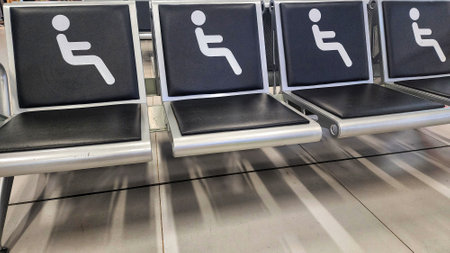 Stainless steel chairs in the airport waiting area for passengers.の写真素材