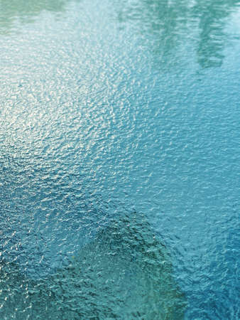 Photography showing tree reflection on water surface can be used as abstract background for summer...