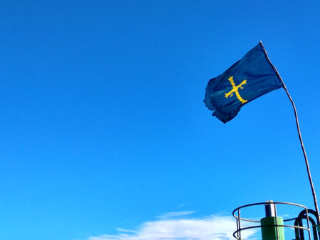 Asturias flag in the port of Tazones, a small fishing village in the East of Asturias, Spainの写真素材