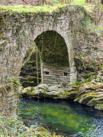 Ancient Roman bridge over the Pulley river in Villayon, Asturias, Spain, Europe