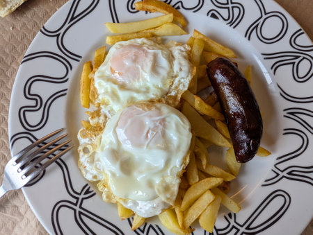 Potatoes, eggs and chorizo, typical meal in Asturias called Plato de la Abuela, Spainの写真素材