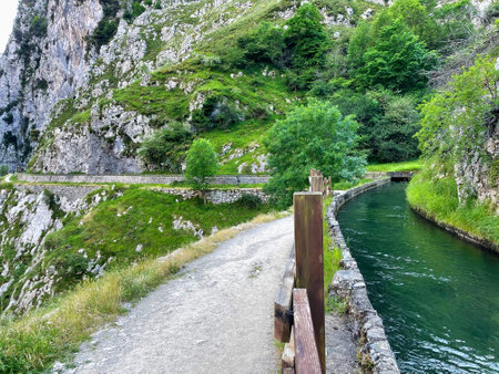 Water channeling and path at Ruta del Cares Canyon, in the Picos de Europa National Park, between Asturias and Leon provinces, Spainの写真素材