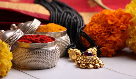 oti bharne - Indian ritual of offering a sari and a blouse piece along with coconut, haldi kumkum, bangles, mangalsutra and rice. At the time of navratri to goddes or married woman.の写真素材