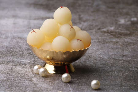 Indian Sweet Rasgulla Also Know as Rosogolla, Roshogolla, Rasagola, Ras Gulla, Anguri Rasgulla or Angoori Rasgulla is a Syrupy Dessert Popular in India. It is Madeup with milk.の写真素材
