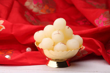 Indian Sweet Rasgulla Also Know as Rosogolla, Roshogolla, Rasagola, Ras Gulla, Anguri Rasgulla or Angoori Rasgulla is a Syrupy Dessert Popular in India. It is Madeup with milk.の写真素材