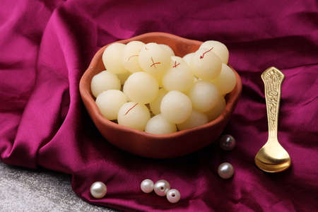Indian Sweet Rasgulla Also Know as Rosogolla, Roshogolla, Rasagola, Ras Gulla, Anguri Rasgulla or Angoori Rasgulla is a Syrupy Dessert Popular in India. It is Madeup with milk.の写真素材