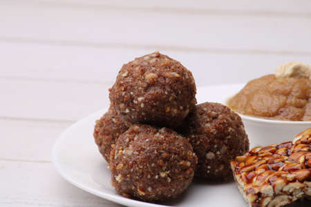 Navratri Upwas sweets food platter dry fruit laddu, groundnut chikki or toffee and sheera.の写真素材