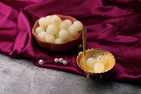 Indian Sweet Rasgulla Also Know as Rosogolla, Roshogolla, Rasagola, Ras Gulla, Anguri Rasgulla or Angoori Rasgulla is a Syrupy Dessert Popular in India. It is Madeup with milk.の写真素材
