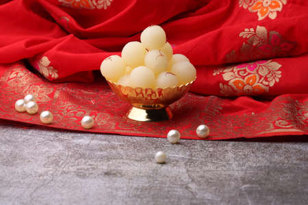 Indian Sweet Rasgulla Also Know as Rosogolla, Roshogolla, Rasagola, Ras Gulla, Anguri Rasgulla or Angoori Rasgulla is a Syrupy Dessert Popular in India. It is Madeup with milk.の写真素材