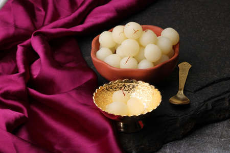 Indian Sweet Rasgulla Also Know as Rosogolla, Roshogolla, Rasagola, Ras Gulla, Anguri Rasgulla or Angoori Rasgulla is a Syrupy Dessert Popular in India. It is Madeup with milk.の写真素材
