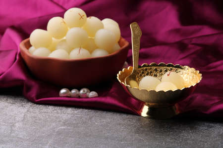 Indian Sweet Rasgulla Also Know as Rosogolla, Roshogolla, Rasagola, Ras Gulla, Anguri Rasgulla or Angoori Rasgulla is a Syrupy Dessert Popular in India. It is Madeup with milk.の写真素材