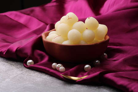 Indian Sweet Rasgulla Also Know as Rosogolla, Roshogolla, Rasagola, Ras Gulla, Anguri Rasgulla or Angoori Rasgulla is a Syrupy Dessert Popular in India. It is Madeup with milk.の写真素材