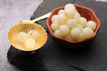 Indian Sweet Rasgulla Also Know as Rosogolla, Roshogolla, Rasagola, Ras Gulla, Anguri Rasgulla or Angoori Rasgulla is a Syrupy Dessert Popular in India. It is Madeup with milk.の写真素材