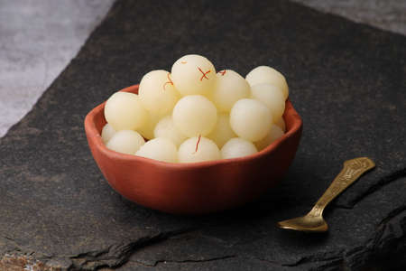 Indian Sweet Rasgulla Also Know as Rosogolla, Roshogolla, Rasagola, Ras Gulla, Anguri Rasgulla or Angoori Rasgulla is a Syrupy Dessert Popular in India. It is Madeup with milk.の写真素材