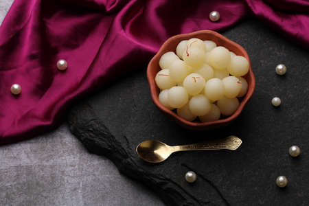 Indian Sweet Rasgulla Also Know as Rosogolla, Roshogolla, Rasagola, Ras Gulla, Anguri Rasgulla or Angoori Rasgulla is a Syrupy Dessert Popular in India. It is Madeup with milk.の写真素材
