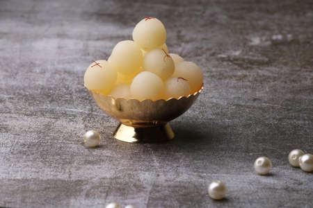 Indian Sweet Rasgulla Also Know as Rosogolla, Roshogolla, Rasagola, Ras Gulla, Anguri Rasgulla or Angoori Rasgulla is a Syrupy Dessert Popular in India. It is Madeup with milk.の写真素材