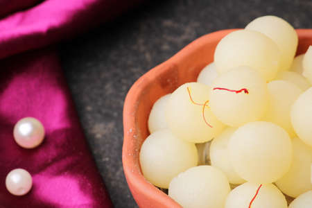 Indian Sweet Rasgulla Also Know as Rosogolla, Roshogolla, Rasagola, Ras Gulla, Anguri Rasgulla or Angoori Rasgulla is a Syrupy Dessert Popular in India. It is Madeup with milk.の写真素材