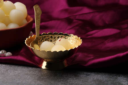 Indian Sweet Rasgulla Also Know as Rosogolla, Roshogolla, Rasagola, Ras Gulla, Anguri Rasgulla or Angoori Rasgulla is a Syrupy Dessert Popular in India. It is Madeup with milk.の写真素材