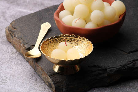 Indian Sweet Rasgulla Also Know as Rosogolla, Roshogolla, Rasagola, Ras Gulla, Anguri Rasgulla or Angoori Rasgulla is a Syrupy Dessert Popular in India. It is Madeup with milk.の写真素材