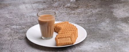 Cutting Chai, Traditional Desi Roadside tea of india with biscuits.