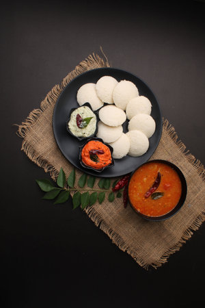 Idly sambar or Idli with Sambhar and green, red chutney. Popular South indian breakfastの素材 [FY310161800279]