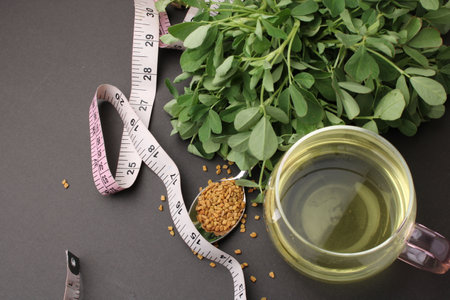 Close up of Fenugreek with its seeds and powder and the extracted water. It helps in numerous...