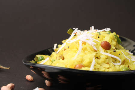 Indian Breakfast aalu Poha Also Know as kande Pohe made up of Beaten Rice or Flattened Rice.