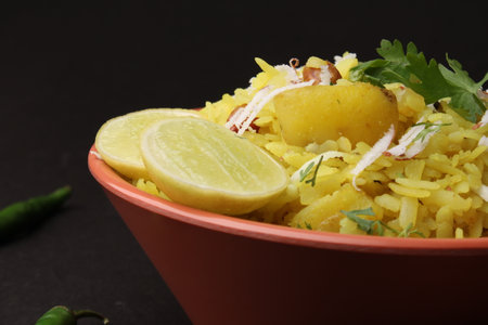 Indian Breakfast aalu Poha Also Know as kande Pohe made up of Beaten Rice or Flattened Rice.
