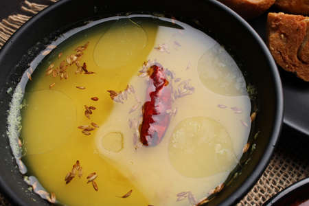 bafle or bati is popular main course dish in India served with dal daal brinjal curry jaggery gud and clarified butter or gheeの写真素材