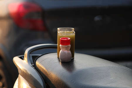 Sugarcane juice in glass with piece of sugarcane, lemon and black saltの写真素材