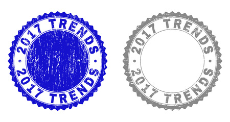 2017 TRENDS stamp seals with distress texture in blue and gray colors isolated on white background. Vector rubber imitation of 2017 TRENDS caption inside round rosette.のイラスト素材