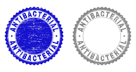 Grunge ANTIBACTERIAL stamp seals isolated on a white background. Rosette seals with grunge texture in blue and gray colors. Vector rubber watermark of ANTIBACTERIAL label inside round rosette.のイラスト素材
