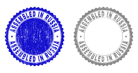 Grunge ASSEMBLED IN RUSSIA stamp seals isolated on a white background. Rosette seals with grunge texture in blue and grey colors.のイラスト素材