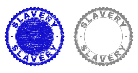 Grunge SLAVERY stamp seals isolated on a white background. Rosette seals with grunge texture in blue and gray colors. Vector rubber stamp imitation of SLAVERY tag inside round rosette.のイラスト素材