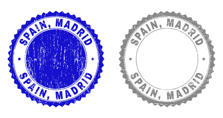 Grunge SPAIN, MADRID stamp seals isolated on a white background. Rosette seals with grunge texture in blue and grey colors. Vector rubber stamp imprint of SPAIN, MADRID title inside round rosette.のイラスト素材