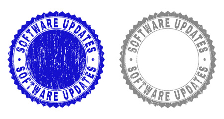 Grunge SOFTWARE UPDATES stamp seals isolated on a white background. Rosette seals with grunge texture in blue and gray colors.のイラスト素材