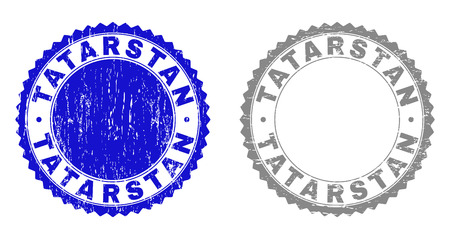 Grunge TATARSTAN stamp seals isolated on a white background. Rosette seals with grunge texture in blue and grey colors. Vector rubber stamp imitation of TATARSTAN title inside round rosette.のイラスト素材