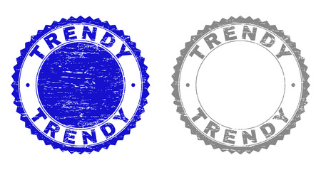 Grunge TRENDY stamp seals isolated on a white background. Rosette seals with distress texture in blue and gray colors. Vector rubber stamp imprint of TRENDY text inside round rosette.のイラスト素材