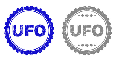 Grunge UFO stamp seals isolated on a white background. Rosette seals with grunge texture in blue and gray colors. Vector rubber stamp imitation of UFO tag inside round rosette.のイラスト素材