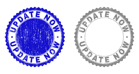 Grunge UPDATE NOW stamp seals isolated on a white background. Rosette seals with distress texture in blue and gray colors. Vector rubber stamp imitation of UPDATE NOW caption inside round rosette.のイラスト素材