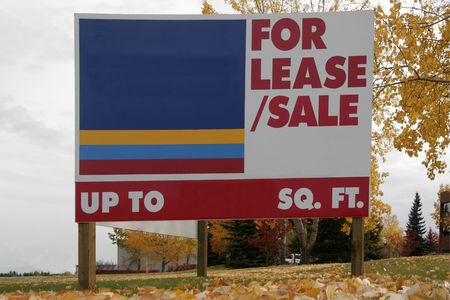 For sale/lease sign in a fieldの写真素材