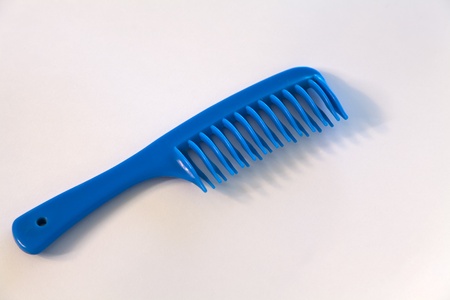 Hair plastic comb isolated, white background. Closeup shot. の写真素材