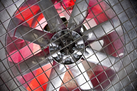 Industrial fan behind a metal grate, の写真素材