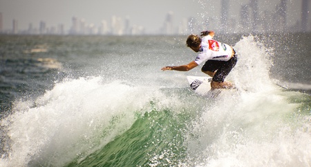 SNAPPER ROCKS, GOLD COAST, AUSTRALIA - FEB 26: Unidentified Surfer races the Quiksilver & Roxy Pro World Title Event. February 26, 2012, Snapper Rocks, Gold Coast, Australia のeditorial素材