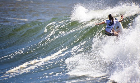 SNAPPER ROCKS, GOLD COAST, AUSTRALIA - 26 FEB: Unidentified Surfer races the Quiksilver & Roxy Pro World Title Event. 26 February 2012, Snapper Rocks, Gold Coast, Australia のeditorial素材