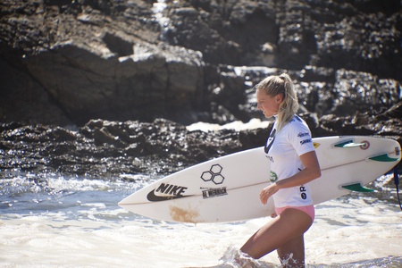 SNAPPER ROCKS, GOLD COAST, AUSTRALIA - 26 FEB: Unidentified Surfer races the Quiksilver & Roxy Pro World Title Event. 26 February 2012, Snapper Rocks, Gold Coast, Australia のeditorial素材
