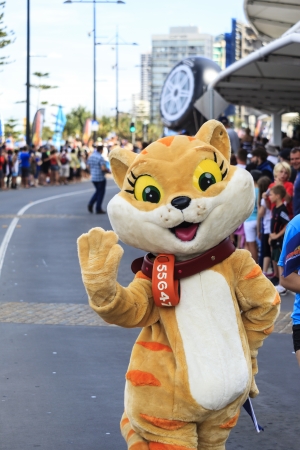 SURFERS PARADISE  OCTOBER - 25 Unidentified entertainers and spectators marching during the Gold Coast 600 V-8 Supercar race over the race course  October- 25- 2013 Gold Coast Australia  のeditorial素材