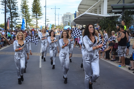 SURFERS PARADISE  OCTOBER - 25 Unidentified entertainers and spectators marching during the Gold Coast 600 V-8 Supercar race over the race course  October- 25- 2013 Gold Coast Australia  のeditorial素材