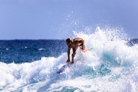 SNAPPER ROCKS, GOLD COAST, AUSTRALIA - 5 MARCH  Unidentified Surfer races the Quiksilver   Roxy Pro World Title Event  5 March 2014, Snapper Rocks, Gold Coast, Australia のeditorial素材